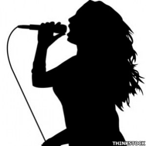 7f6512_woman_singing_into_microphone_in_silhouette_300
